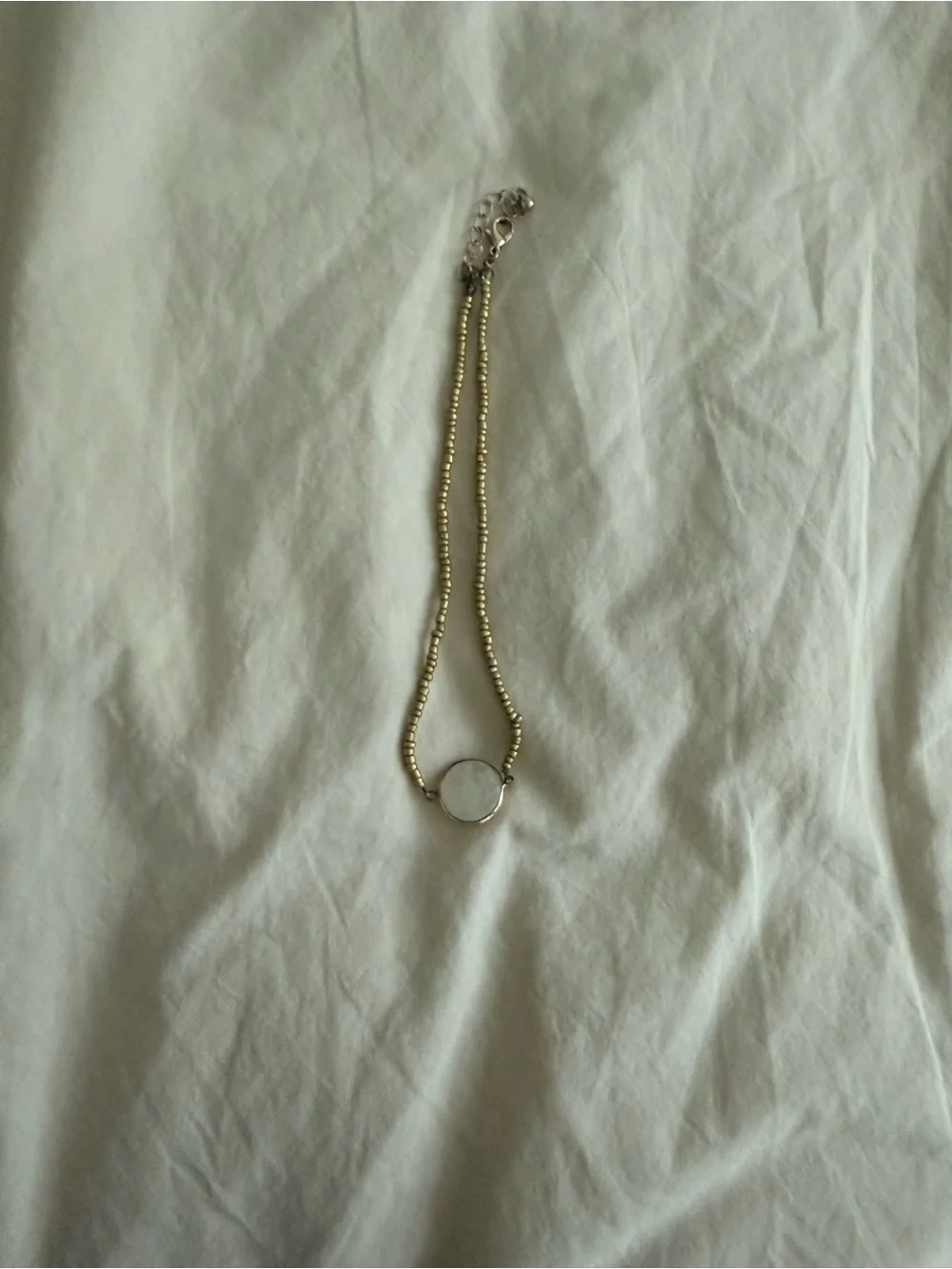 Gold Beaded Necklace with White Disc Pendant